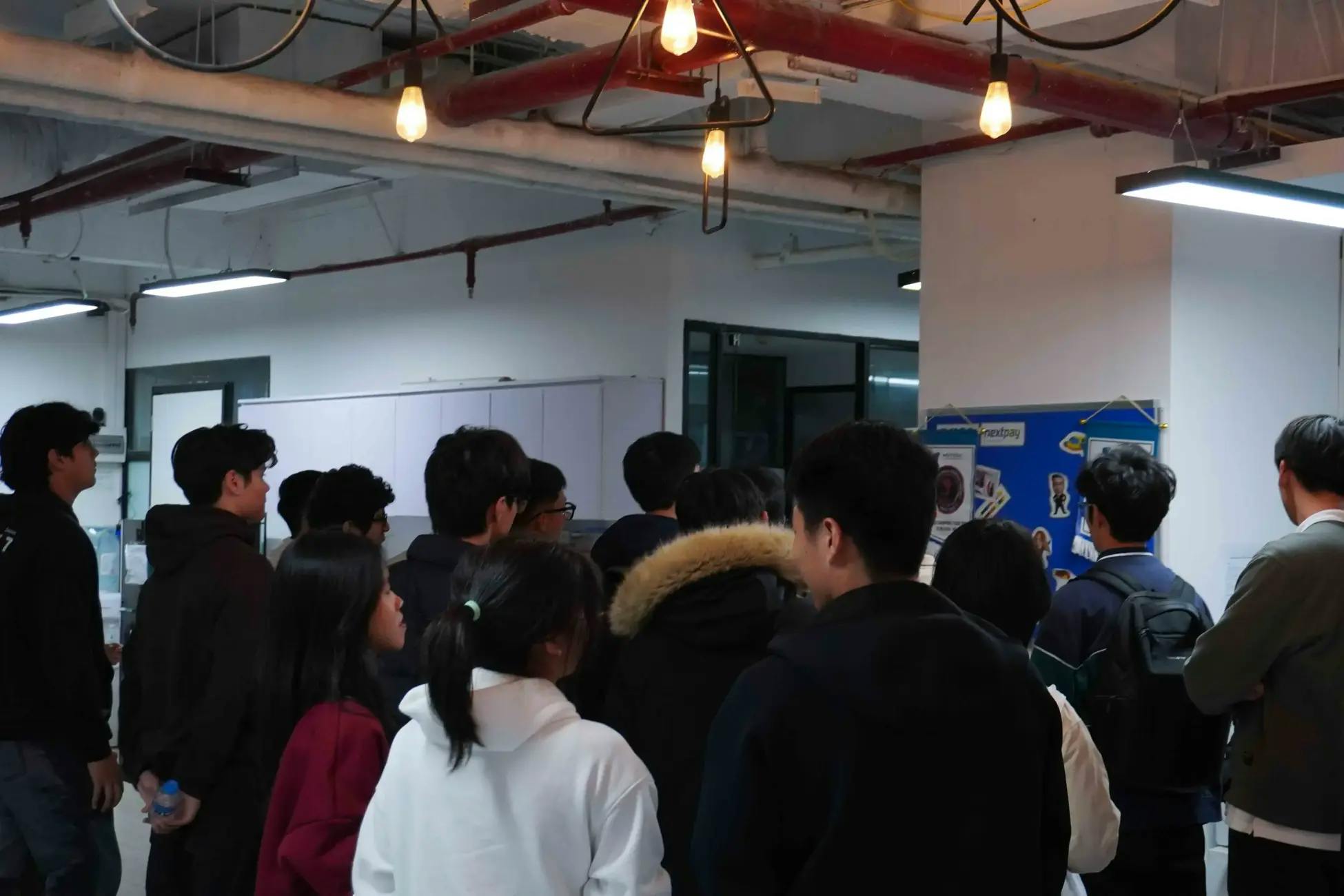 A backshot of a group of students at a field trip event